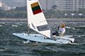 The innate simplicity of Bruce Kirby's Laser  design was a key factor in its success.  Gintare Scheidt (LTU) practicing in the squall ahead of the Laser Radial Medal Race - Rio 2016 © Richard Gladwell / Photosport