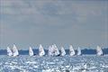 Rare rays of sunshine broke through the rainy and gray strong wind day at the Olympic ILCA 6 at Kieler Woche