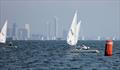 ILCA 6 fleet downwind with the OKs and ILCA 7s in the background on day 1 of the Open Masters Championship 2026