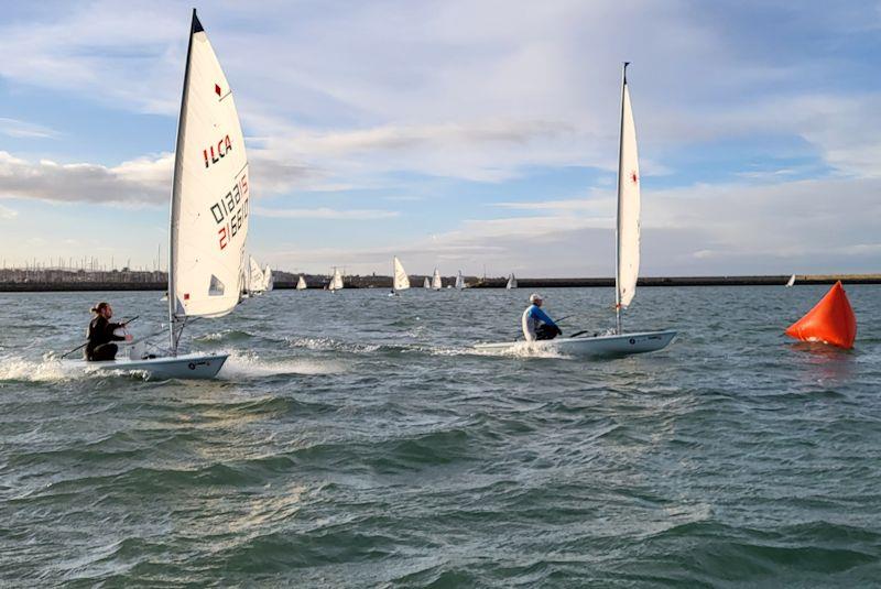 Gybe mark action - Viking Marine DMYC Frostbite Series 2 day 2 photo copyright Ian Cutliffe taken at Dun Laoghaire Motor Yacht Club and featuring the ILCA 6 class