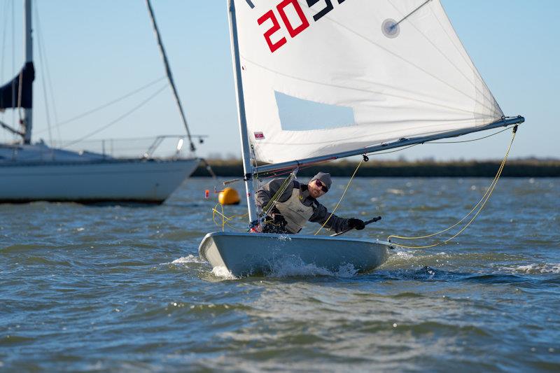 James Hutton-Penman, mid-gybe - third week of the RCYC Snow Globe photo copyright Petru Balau Sports Photography / sports.hub47.com taken at Royal Corinthian Yacht Club, Burnham and featuring the ILCA 6 class