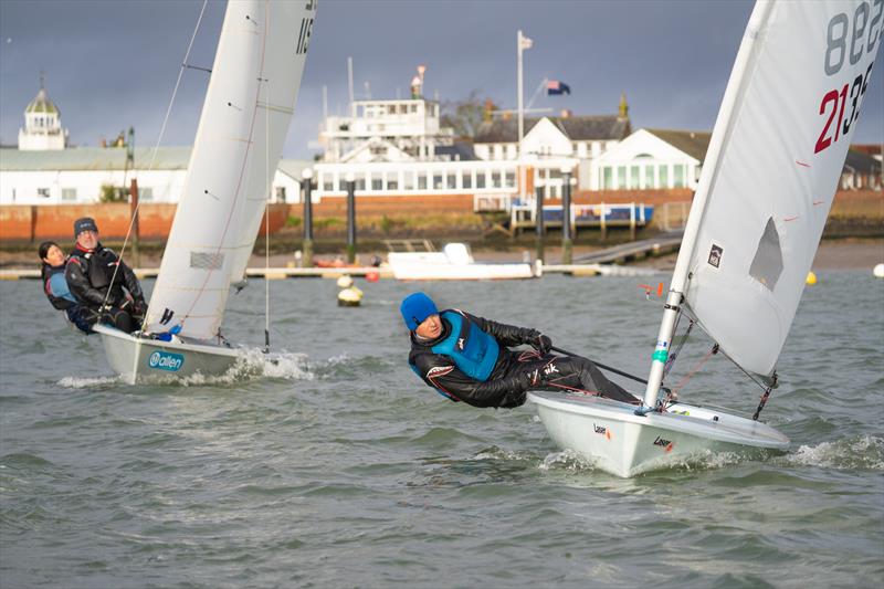 Keith Gilmore tacks in front of Jo Tribe and Marcus Collingbourne during the the Royal Corinthian Yacht Club SnowGlobe photo copyright Petru Balau Sports Photography / sports.hub47.com taken at Royal Corinthian Yacht Club and featuring the ILCA 6 class