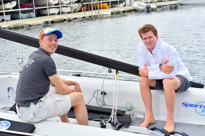 French sailor Hugo Feydit (left) and Tasmanian Sam King swap ideas about the SB20 - photo © Jane Austin