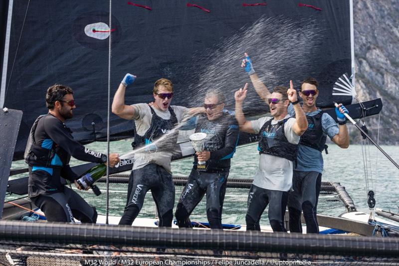 Bliksem with skipper Pieter Taselaar spraying the prosecco in Riva - M32 European Championships 2022 - photo © M32World / Felipe Juncadella