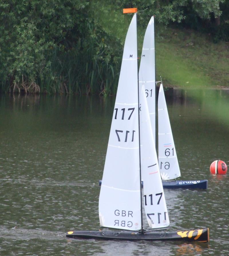 Colln's GRUNGE and Roger's UP are neck and neck at the finish during Marblehead GAMES 9 at Radio Sailing Woking photo copyright Ray Darby taken at Radio Sailing Woking and featuring the Marblehead class