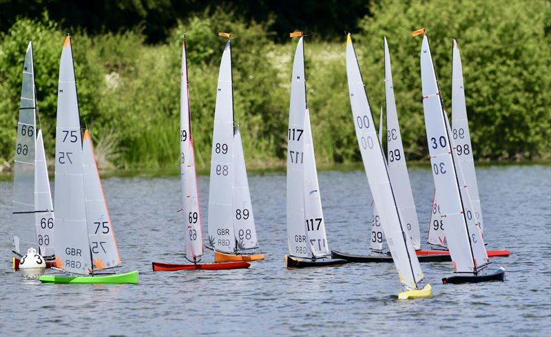 Whilst Peter Jackson 30 and John Cleave 00 are beating to the windward mark, the rest of the fleet are tightly packed and chasing Tony Edwards round the spreader mark during the Marblehead Mermaid Trophy photo copyright Gillian Pearson taken at Guildford Model Yacht Club and featuring the Marblehead class