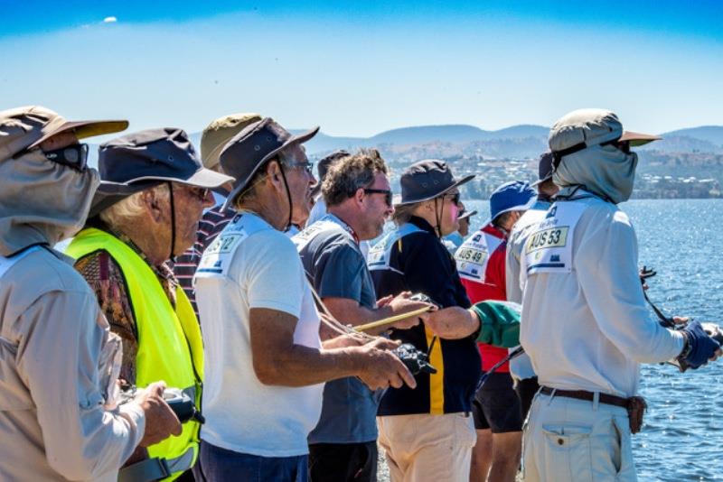 Concentration amongst the skippers at the windward mark - photo © Robert Gavin