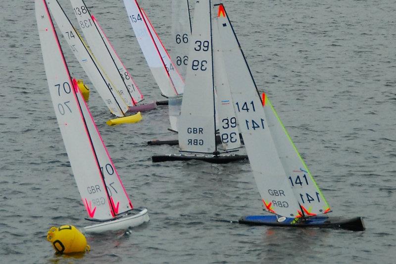 Just after the start with Rob Vice getting the best of it - Marblehead GAMES 7 at Littleton with Guildford MYC photo copyright Roger Stollery taken at Guildford Model Yacht Club and featuring the Marblehead class