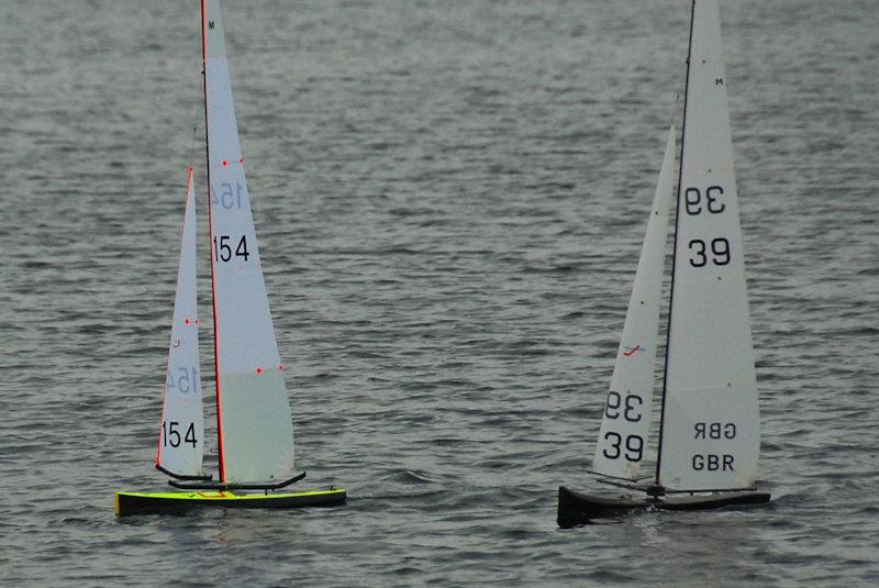 Another close encounter, Nigel Barrow and Peter Stollery - Marblehead GAMES 7 at Littleton with Guildford MYC photo copyright Roger Stollery taken at Littleton Sailing Club and featuring the Marblehead class