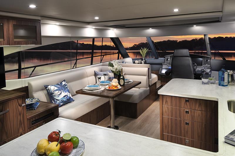Stylish saloon and gourmet galley of the Riviera 5400 Sport Yacht.