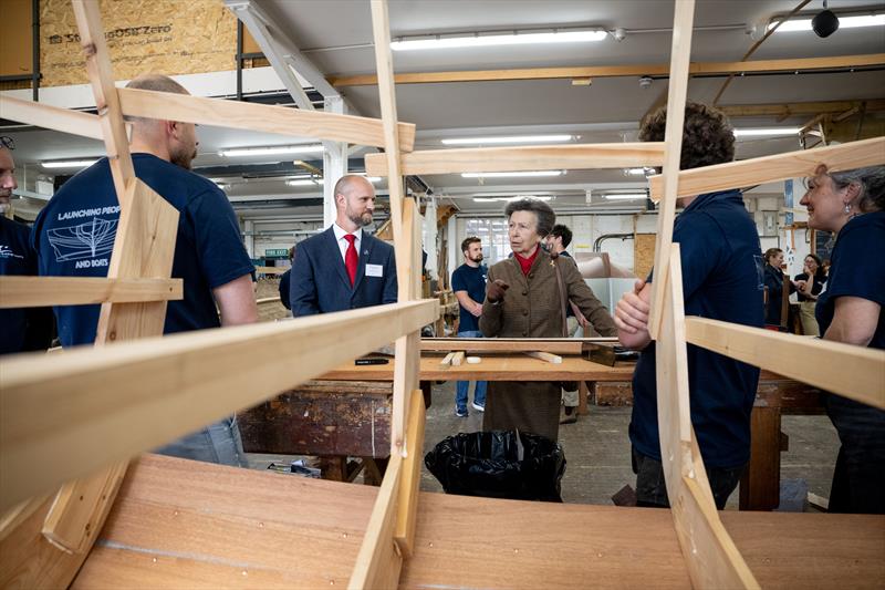 HRH The Princess Royal was given a tour of the Boat Building Academy in Lyme Regis by Director Will Reed (left) and met past and present students photo copyright Philippa Gedge Photography taken at  and featuring the Marine Industry class