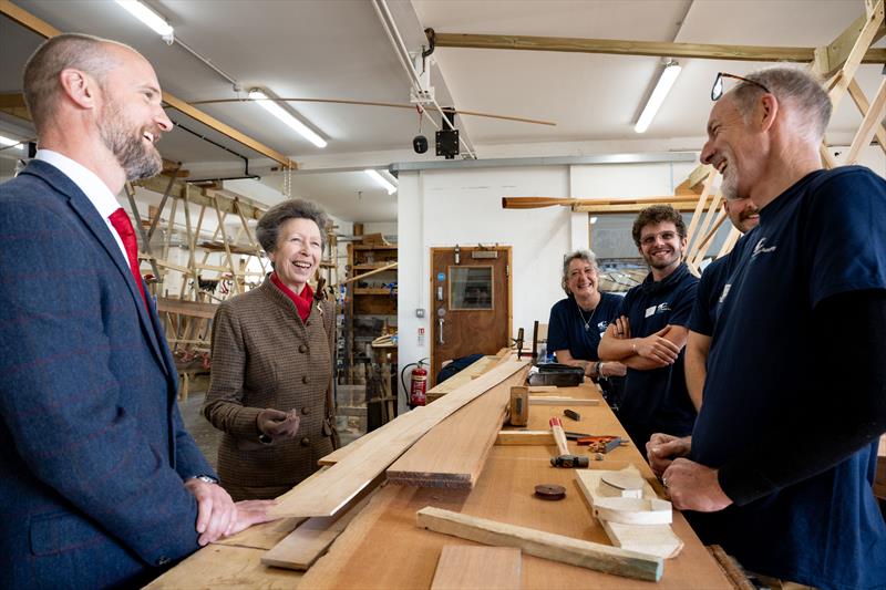HRH The Princess Royal was given a tour of the Boat Building Academy in Lyme Regis by Director Will Reed (left) and met past and present students photo copyright Philippa Gedge Photography taken at  and featuring the Marine Industry class