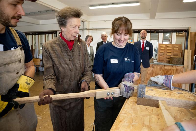 HRH The Princess Royal assists students of the Boat Building Academy during a demonstration of steam bending photo copyright Philippa Gedge Photography taken at  and featuring the Marine Industry class
