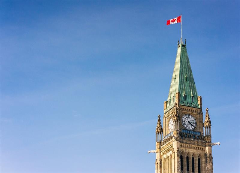 A Canadian flag flying on the top of the Peace Tower, part of the Canadian Parliament Building in Ottawa - photo © George Clerk