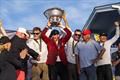 Riptide Racing's Chris Poole hold the Congressional Cup aloft
