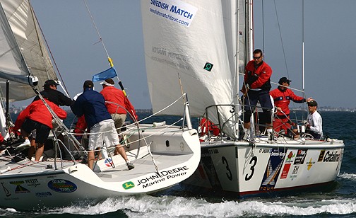  The boats are still bumping as Brady (right) appeals to the umpires for a foul call against Appleton, which soon followed at the Congressional Cup photo copyright Rich Roberts taken at Long Beach Yacht Club and featuring the Match Racing class