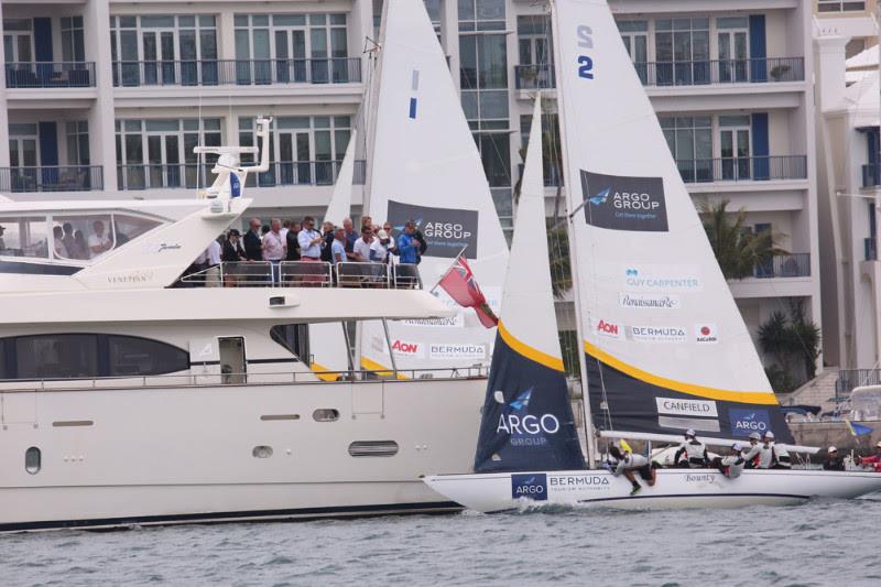 Taylor Canfield (Boat 2) sails over the top of the VIP hospitality boat while Lucy Macgregor is forced to sail to leeward. That gave Canfield a slim lead after both boats tacked to starboard in the deciding Race 4 of their Semifinal match photo copyright Charles Anderson / RBYC taken at Royal Bermuda Yacht Club and featuring the Match Racing class