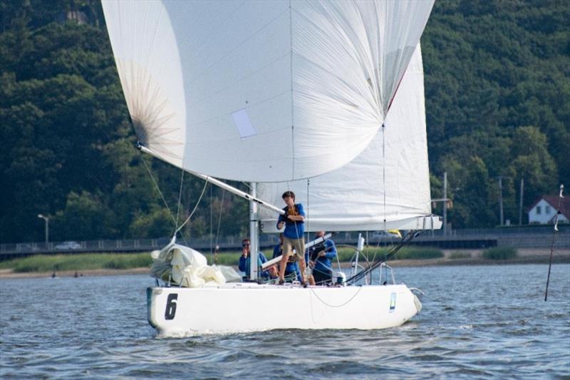 Trainee Joe Richter puts out the pole during Saturday's racing. - photo © Lexi Pline / Oakcliff Sailing