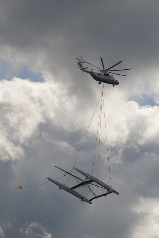 Alinghi launches its giant catamaran on Lake Geneva by helicopter photo copyright Stefano Gattini / Alinghi taken at  and featuring the Maxi Cat class