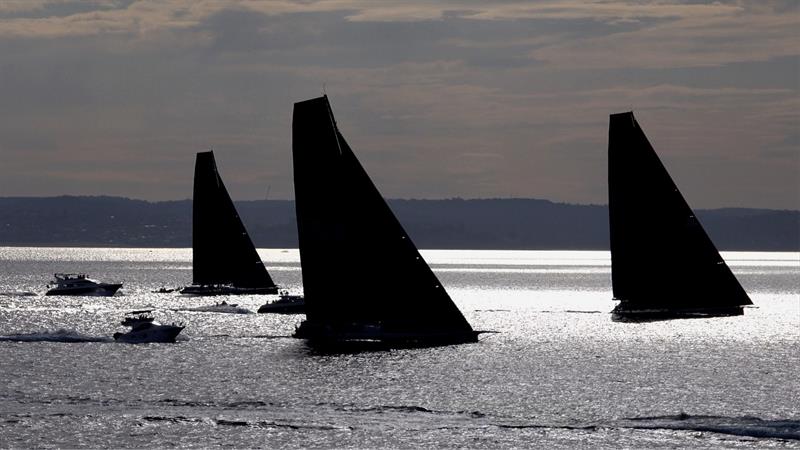 Supermaxis in silhouette after the 2018 Noakes Sydney Gold Coast Yacht Race start photo copyright Dale Lorimer taken at Cruising Yacht Club of Australia and featuring the Maxi class