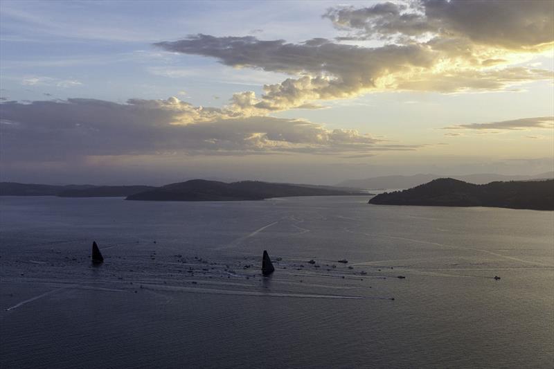 Spectators amass as Wild Oats XI and LDV Comanche head for the finish. - photo © Andrea Francolini