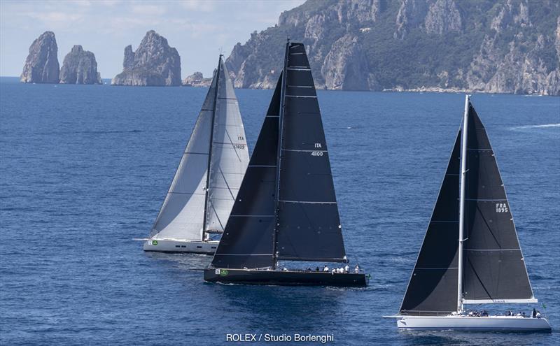 Conditions turned light then died as the Maxis ventured out beyond - here showing the famous Faraglioni rocks in the distance - 2018 Rolex Capri Sailing Week photo copyright Carlo Borlenghi taken at Yacht Club Capri and featuring the Maxi class