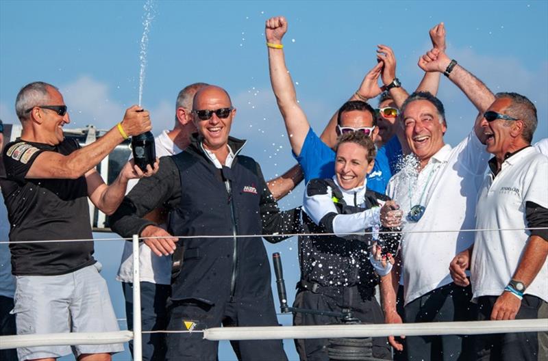 Nicola Paoleschi celebrates line honours victory with Alessandra Sensini and the crew of Pendragon VI photo copyright Studio Taccola taken at Yacht Club Punta Ala and featuring the Maxi class