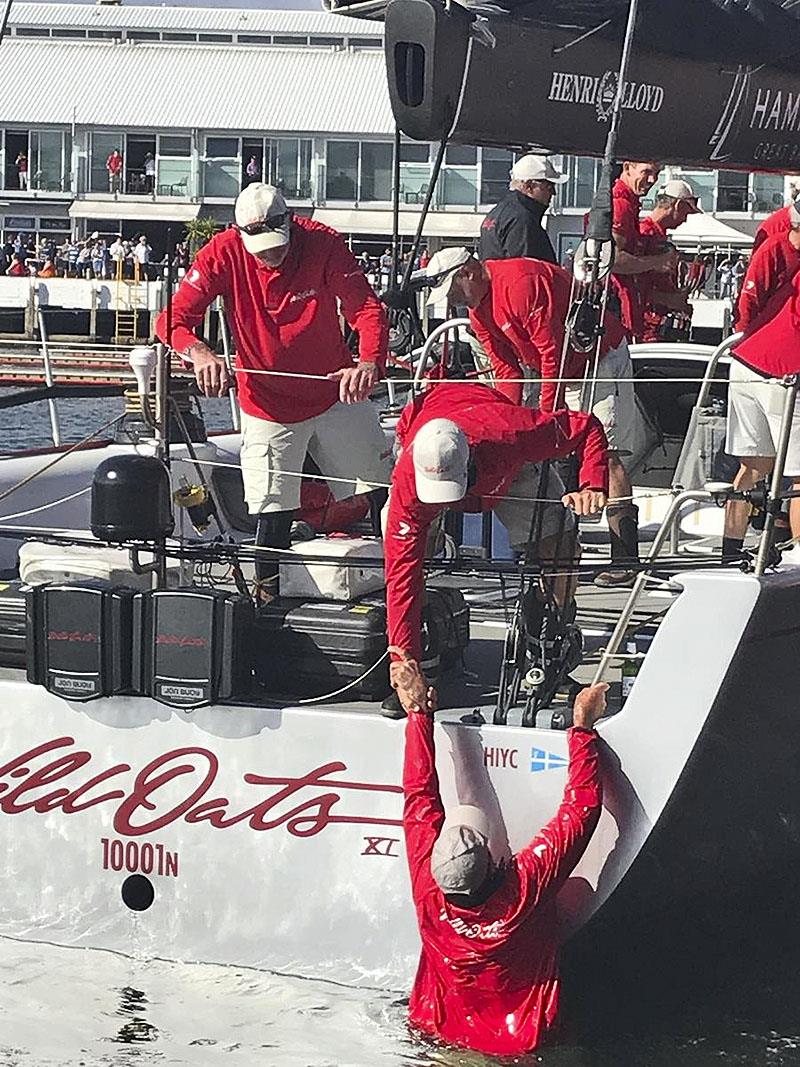 Mark Richards comes back aboard after the traditional push and swim photo copyright Justine Kirkjian / CYCA taken at Cruising Yacht Club of Australia and featuring the Maxi class