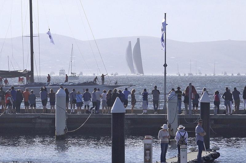 Wild Oats XI motors into Constitution Dock in Hobart as Black Jack brings Comanche and a huge spectator armada down to the finish line. - photo © Dale Lorimer
