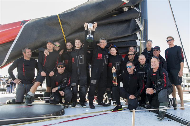 Crew of supermaxi Comanche as Jim and James Cooney hold the John H Illingworth Challenge Cup aloft photo copyright Andrea Francolini taken at Royal Yacht Club of Tasmania and featuring the Maxi class