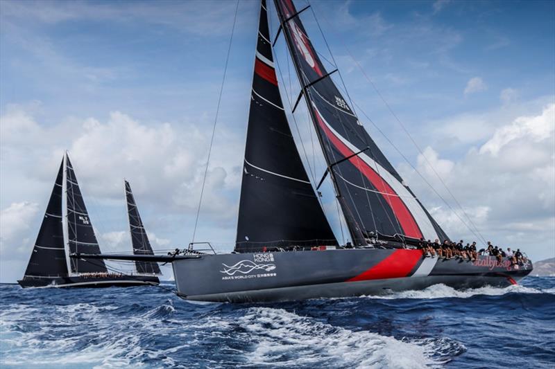 The 100ft Scallywag maxi lines up with the late Sir Peter Harrison's giant ketch Sojana at Antigua Sailing Week photo copyright Paul Wyeth / pwpictures.com taken at Royal Ocean Racing Club and featuring the Maxi class