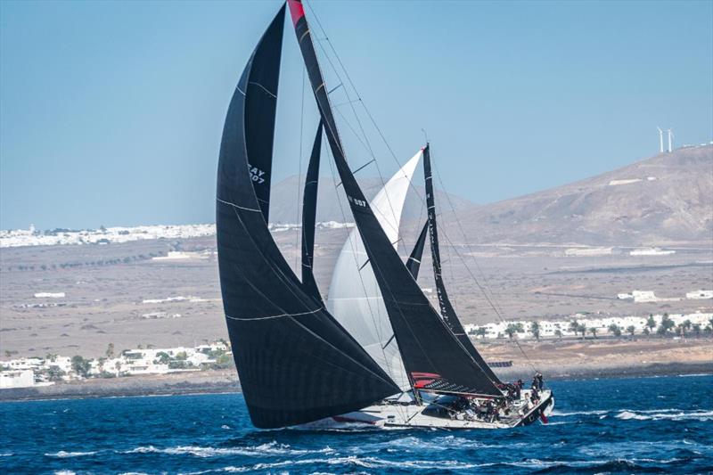 Maxi Comanche (CAY) skippered by Mitch Booth is achieving over 20 knots of boat speed hour after hour on the second day of the RORC Transatlantic Race where tactics split the fleet photo copyright Lanzarote Photo Sport taken at Royal Ocean Racing Club and featuring the Maxi class