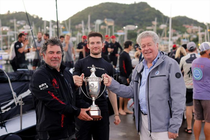 Andrew McIrvine, Secretary General of the IMA presents Mitch Booth, Skipper of Maxi 100 Comanche and Team Comanche with the fine vintage silver IMA Trophy awarded to the monohull line honours winner - photo © Arthur Daniel / RORC