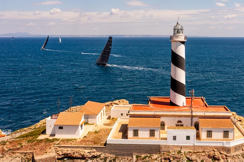 IRC/IMA Maxi fleet & lighthouse of Cala Figuera on day 1 of PalmaVela 2022 - photo © Jacobo Bastos / PalmaVela