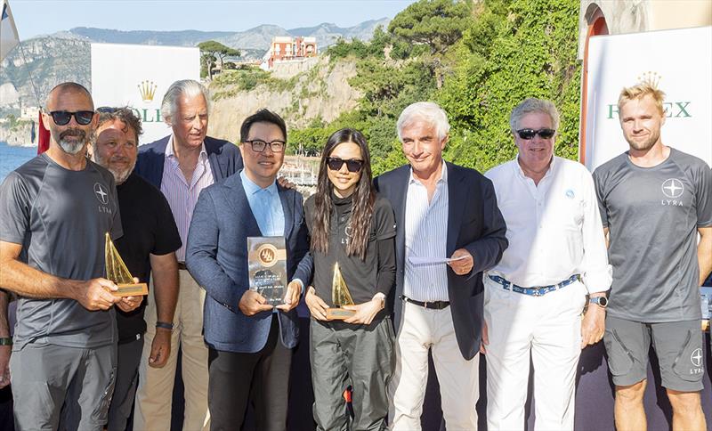 Lyra's Terry and Olivia Hui receive their prizes for winning the IMA Maxi European Championship and the trophy for the Best Placed IMA Member from the CRVI's Roberto Mottola and Maurizio Pavesi and IMA Secretary General Andrew McIrvine photo copyright ROLEX / Studio Borlenghi taken at Circolo del Remo e della Vela Italia and featuring the Maxi class