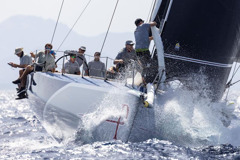 George Sakellaris at the wheel of Proteus en route to winning today's first Mini Maxi 1 windward-leeward on day 2 of the Maxi Yacht Rolex Cup photo copyright IMA / Studio Borlenghi taken at Yacht Club Costa Smeralda and featuring the Maxi class