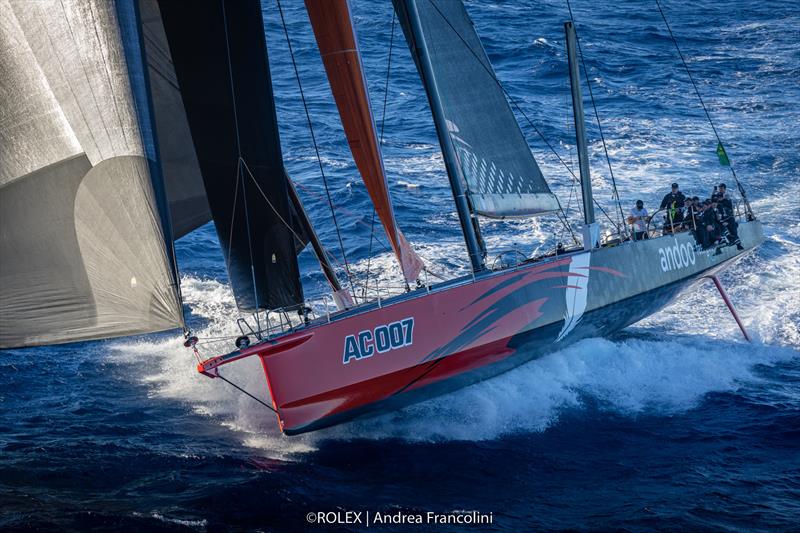 Andoo Comanche surges towards the finish for the boat's fourth Line Honours win in the Rolex Sydney Hobart photo copyright Rolex / Andrea Francolini taken at Cruising Yacht Club of Australia and featuring the Maxi class
