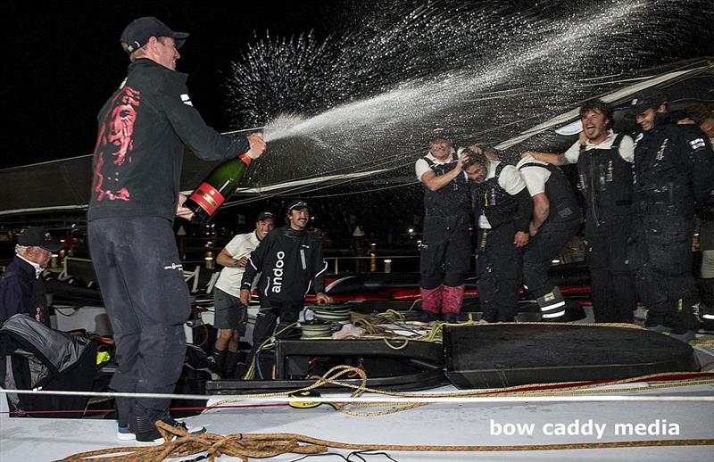 John Winning Jnr with the celebratory champagne spray photo copyright Bow Caddy Media taken at Cruising Yacht Club of Australia and featuring the Maxi class