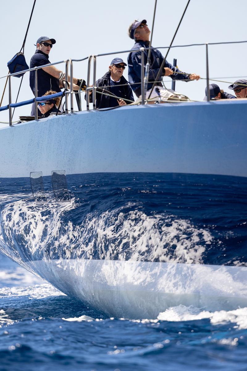 PalmaVela Day 2: Sir Linday Owen-Jones at the helm of Magic Carpet Cubed photo copyright SailingShots by Maria Muiña taken at Real Club Náutico de Palma and featuring the Maxi class