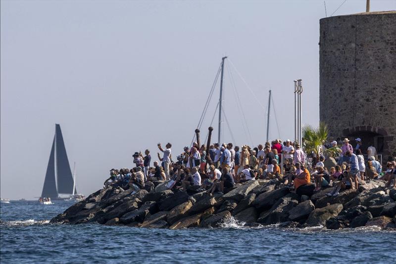 Spectators gather on the Saint-Tropez shoreline to see the starts - Les Voiles de Saint-Tropez 2023, Day 1 photo copyright Gilles Martin-Raget taken at Société Nautique de Saint-Tropez and featuring the Maxi class