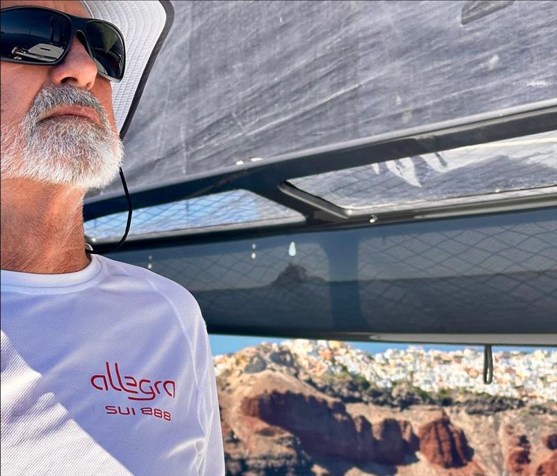 Adrian Keller helms Allegra gingerly past Santorini - photo © Helena Darvelid / Allegra