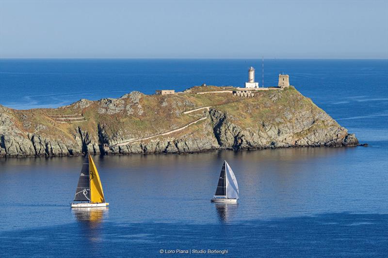 The Grand Soleil 80 LC Bianca II follows the Wally 60 Wallyño of Benoît de Froidmont past the Giraglia rock photo copyright Loro Piana / Studio Borlenghi taken at Yacht Club Italiano and featuring the Maxi class