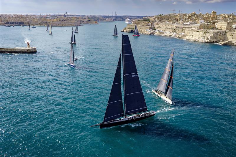 Giovanni Lombardi Stronati's wallyrocket 71 Django 7X chases Remon Vos' 100ft Black Jack away from Malta following Saturday's start - photo © Kurt Arrigo / Rolex