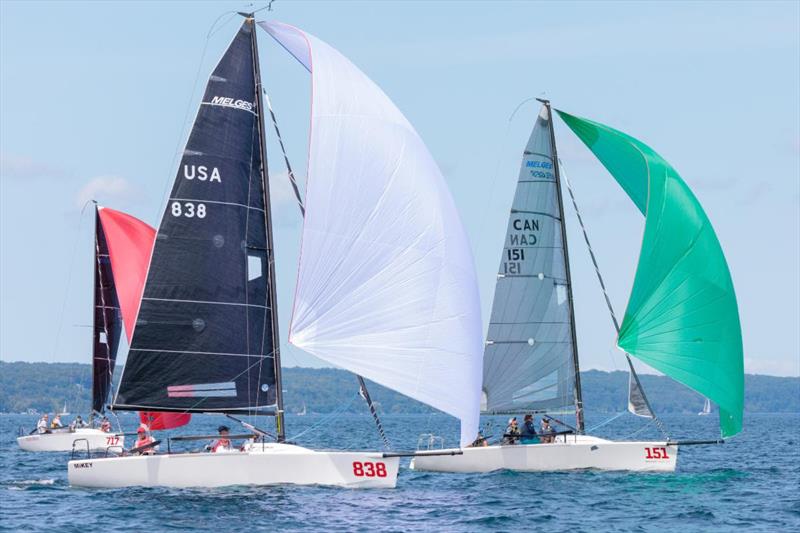 Corinthian power rules - Fraser McMillan (Green Spinnaker) beat Kevin Welch's MiKEY to the finish line in Race Four - 2019 Melges 24 North American Championship photo copyright Bill Crawford - Harbor Pictures Company taken at Grand Traverse Yacht Club and featuring the Melges 24 class