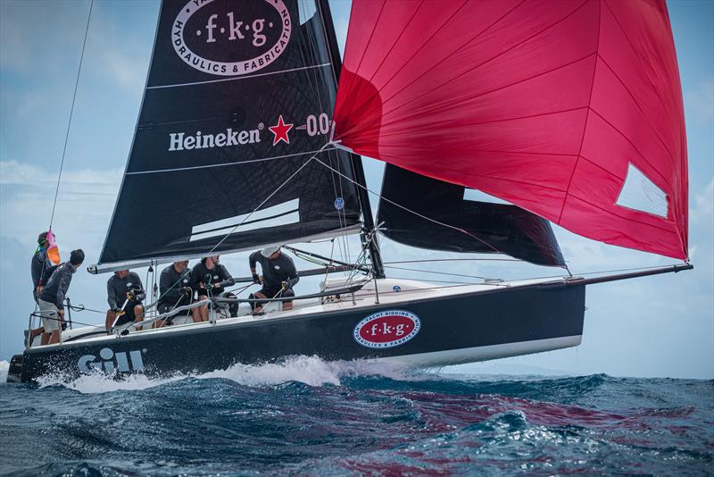 Team F.K.G., Melges 24, gets major air as they wrangle a class win overall in CSA5 at the St. Maarten Heineken Regatta - photo © Laurens Morel