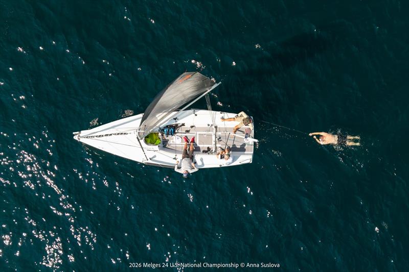 THE ART OF THE WAIT: Seen from above, a Melges 24 team makes most of Saturday's on-the-water postponement. While breeze settled and Race Committee waited for reliable breeze, crews found creative ways to stay active, focused, entertained prior to racing photo copyright Anna Suslova taken at Grand Traverse Yacht Club and featuring the Melges 24 class