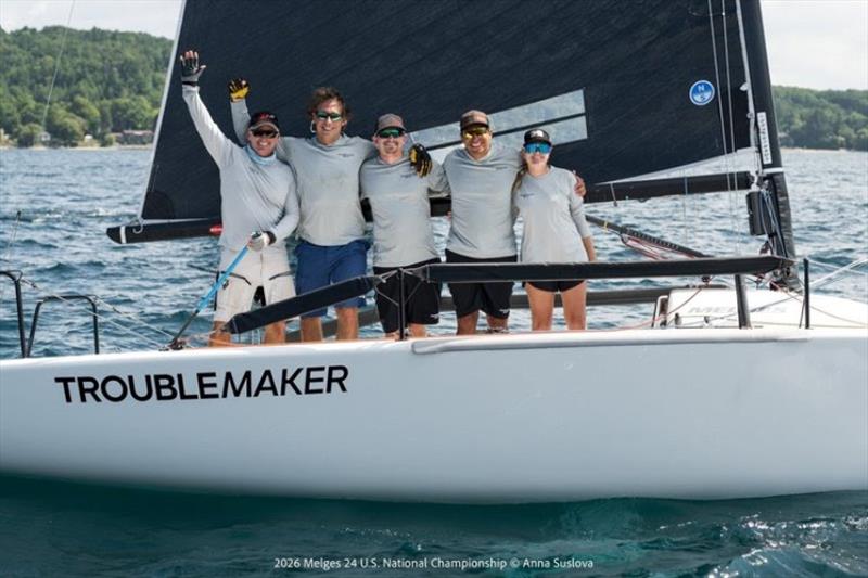 TROUBLEMAKERS, TITLEMAKERS: Eddie Gary and his Troublemaker team celebrate aboard their boat moments after securing the 2026 Corinthian Melges 24 U.S. National Championship on Grand Traverse Bay photo copyright Anna Suslova taken at Grand Traverse Yacht Club and featuring the Melges 24 class
