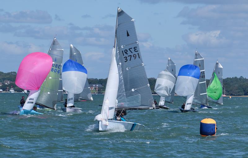 Spinnaker drop during the Lymington Merlin Rocket Open  photo copyright Pat Blake taken at Lymington Town Sailing Club and featuring the Merlin Rocket class