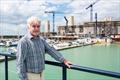 Commodore Phil Thomas of BMYC watches as the new Brighton Marina Yacht Club is moved into its permanent home © Julia Claxton