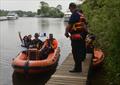 The transatlantic rowers are delivered by York Rescue Boat to the York Railway Institute Sailing Club jetty © Angela Craggs